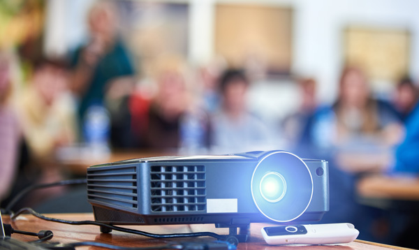 A projector in a college class room.